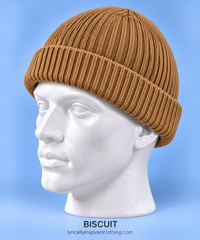 Biscuit ribbed beanie hat displayed on a white mannequin, available from Lyrically Inspired Clothing.